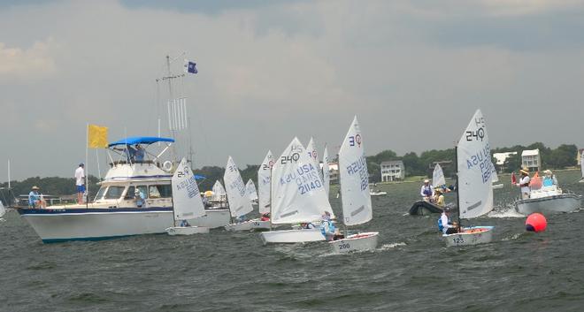 Team Racing is a highlight of all the Optimist Nationals. Two teams of four boats each go head to head. About two dozen teams will compete over three days July 20-22. Over 400 young Optii sailors are expected to race in the Optimist National Championships Fleet Racing July 15-18. Pensacola Yacht Club is the host for 2018 . Come for the competition and be there for the fun. © Talbot Wilson